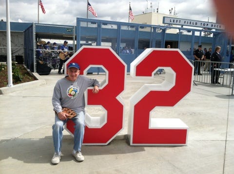 Ross Miller at the No. 32 statue honoring Sandy Koufax at Dodger Stadium.