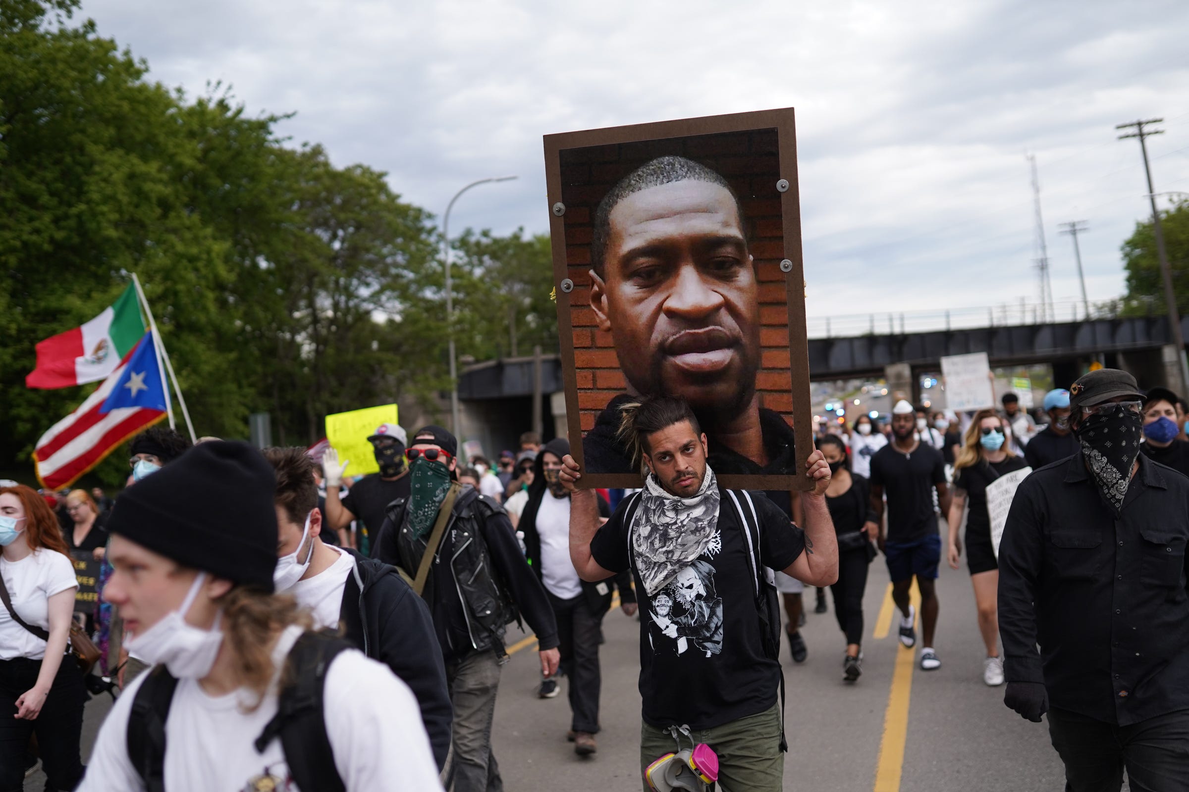 Protesters walk through Detroit on Monday, June 1, 2020 for the fourth day of protesting in the city.