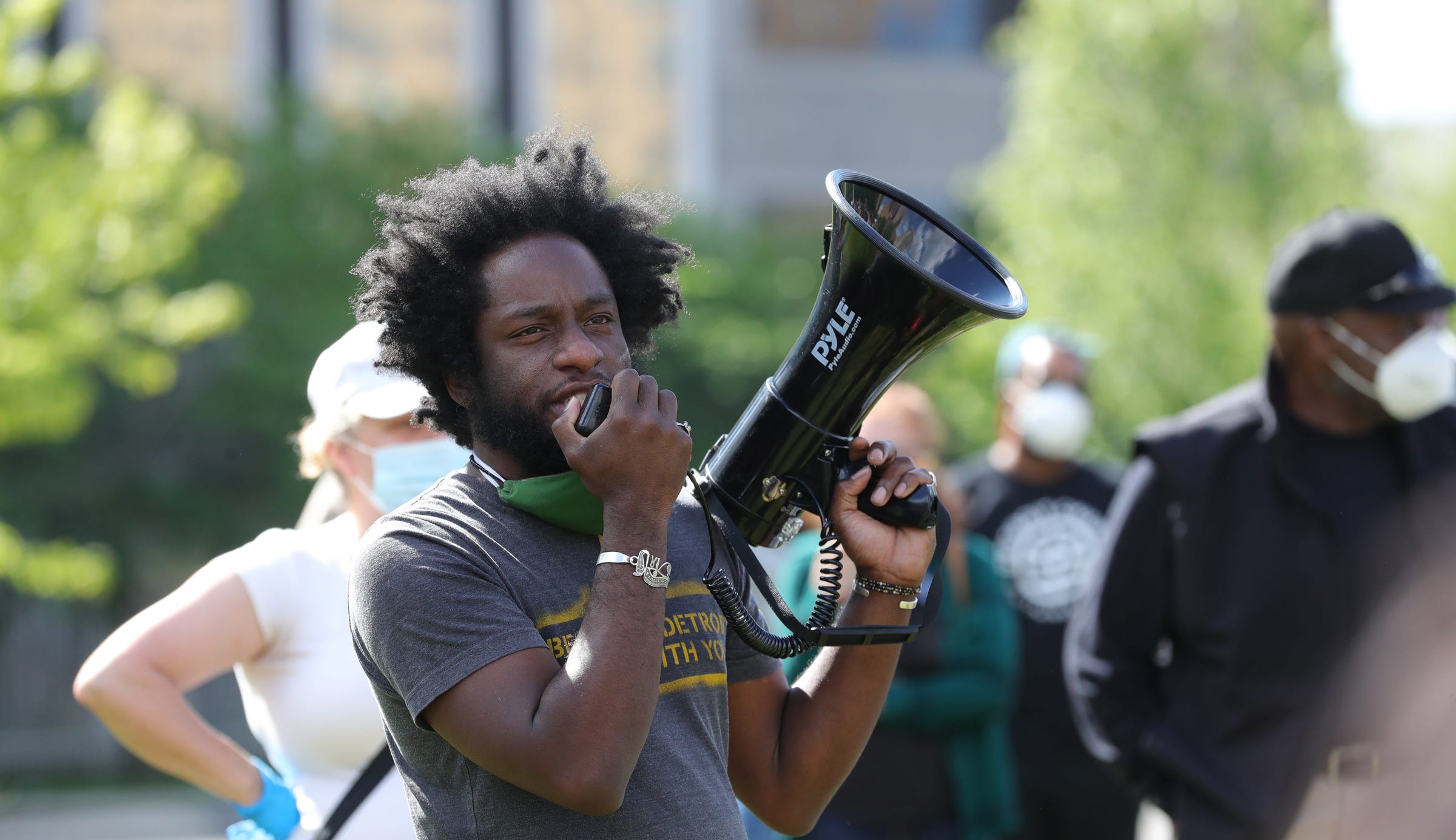Tristan Taylor talks to protesters gathered in front of the Detroit Public Safety Building. Marchers gathered to protest police brutality and the death of George Floyd on Saturday, May 30, 2020 in Detroit. They marched down Michigan Avenue towards Clark Park.