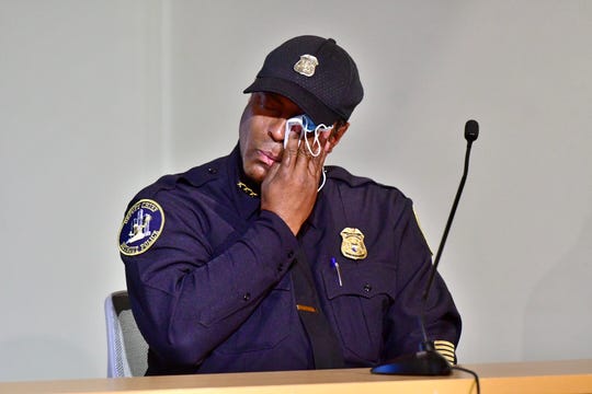 Detroit deputy chief of police Todd Bettison wipes tears from his eyes with his mask after speaking at a press conference at Detroit Police Safety Headquarters, Tuesday. Bettison became emotional after speaking about kneeling with protesters during Sunday evening's protest. (Photo: David Guralnick, The Detroit News)