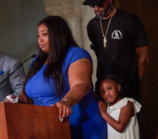 Roxie Washington, the mother of George Floyd's 6-year-old daughter Gianna, center, speaks to the media along with former NBA player, Stephen Jackson, right, a childhood friend of George Floyd, during a press conference at Minneapolis City Hall on Tuesday, June 2, 2020. George Floyd died in Minneapolis police custody on May 25, 2020.