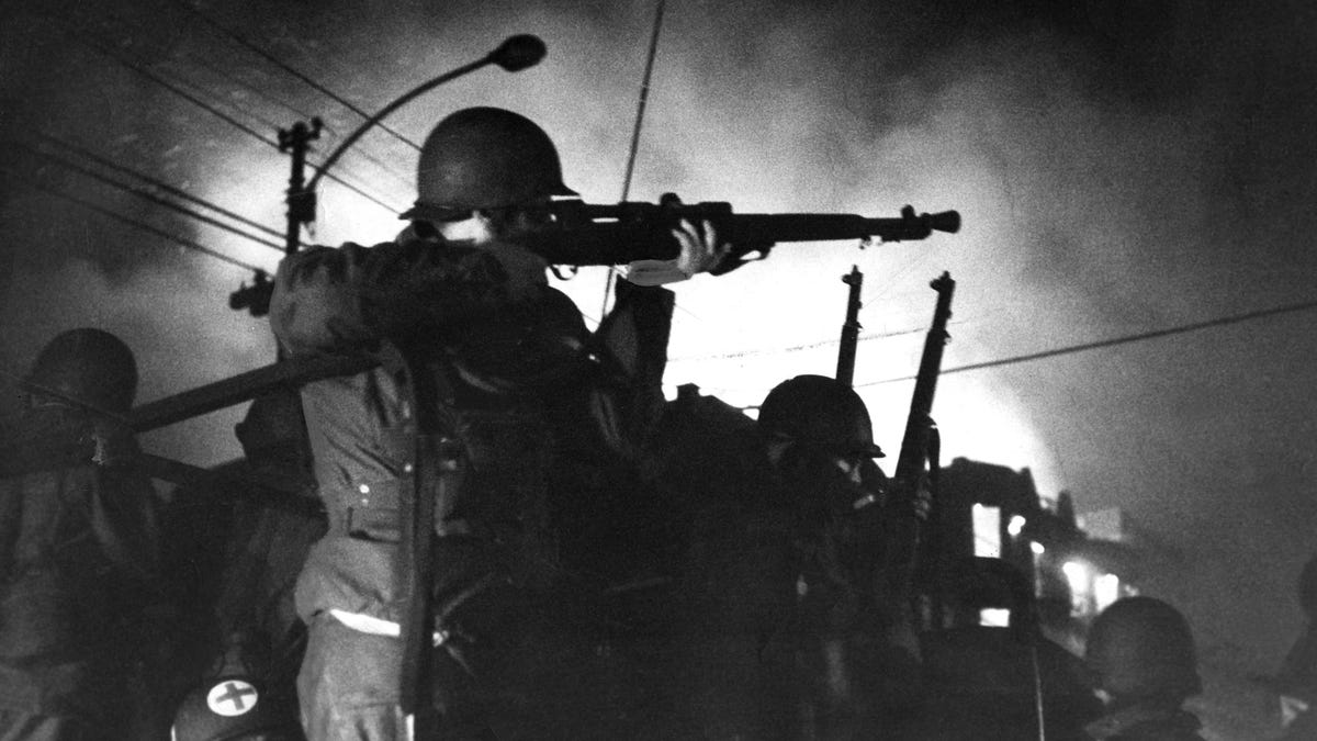 A National Guardsman aims his rifle during Chicago riots in 1968 after Martin Luther King Jr. was assassinated.