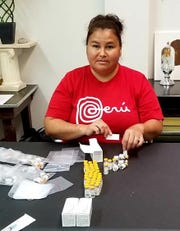 Tena Quackenbush, founder of Stop the Stigma of Addiction and a member of the Ho-Chunk Nation, before the pandemic would prepare naloxone hydrochloride injections (Narcan), which are used to revive victims of opioid overdose.