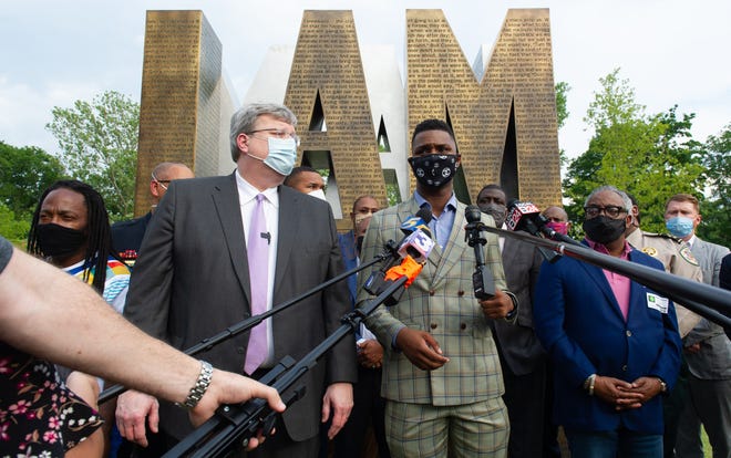 Memphis Mayor Jim Strickland, left and DeVante Hill talk to the media at the I Am A Man Plaza in Memphis, Tenn., prior to the the eighth straight day of protests on Wednesday, June 3, 2020, in reaction to the death of George Floyd, an unarmed black man who died after being pinned down by a white Minneapolis police officer on Memorial Day.