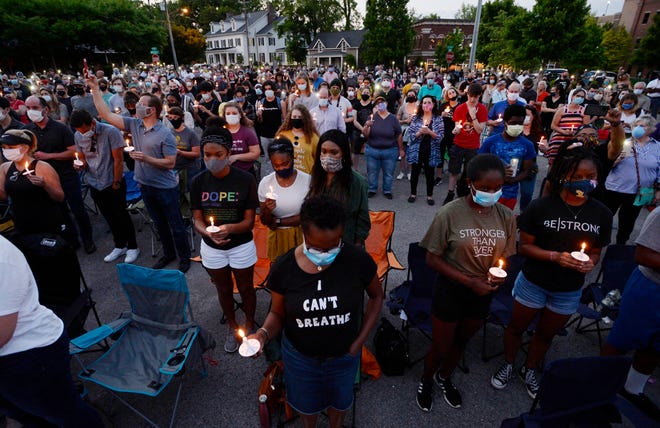Hundreds gathered in Franklin to remember George Floyd, Ahmaud Arbery and Breonna Taylor during the Jesus and Justice candlelight prayer vigil at the Missionary Baptist Church on Tuesday, June 2, 2020, in Franklin, Tenn. New Franklin protest rules could prevent residents from holding similar evening demonstrations on public property.