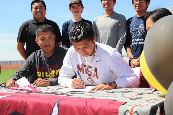 Piedra Vista's Triston Charles signs his national letter of intent on Wednesday, June 3, 2020, to continue his cross-country career at NCAA Division II Colorado Mesa University in Grand Junction, Colorado.