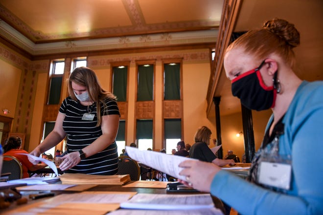 Sydney Tuttle and Melissa Beek sort through ballots on Wednesday, June 3, 2020 at the Old Courthouse Museum in Sioux Falls.