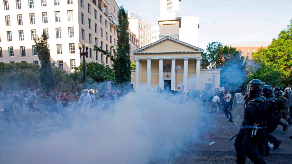 Police officers pepper-spray demonstrators in front of St. John's Episcopal Church near the White House on June 1, 2020.