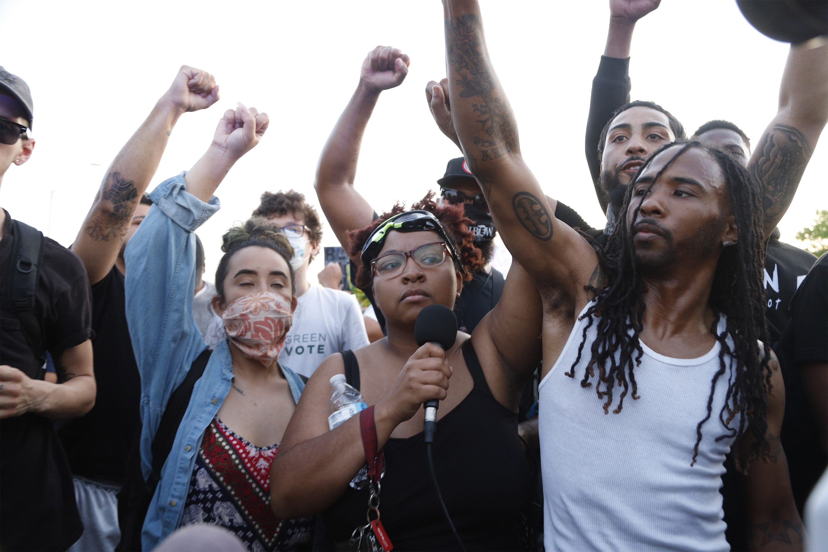 Nakia-Renne Wallace celebrates with protesters on Jefferson Ave as protesters celebrate the end of a curfew called while marching through Detroit on the sixth day of protests against police brutality on Wednesday, June 3, 2020.