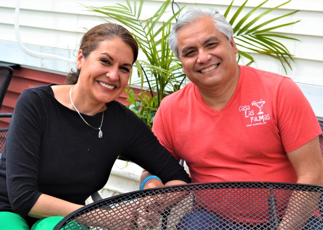 Kelley Kurtz and Camilo Rayo were married in a window wedding on the porch at Ottawa Riverview Health Care Campus so that Kelley’s grandmother, Dorothy Kurtz, could attend the ceremony. The wedding was planned and held just three days after Kurtz was placed in hospice care. She died five days later. Here, Kelley and Camilo sit on the patio of Camilo’s Port Clinton restaurant, Casa Las Palmas.
