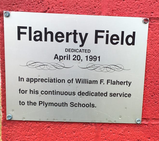 A sign on the visitor's dugout commemorates William F. "Pops" Flaherty. The baseball field the Plymouth Big Red play on is named in his honor.