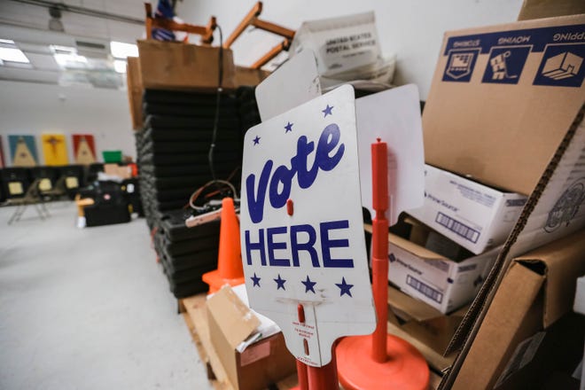 A vote here sign sits in the Doña Ana County Clerk’s Bureau of Elections Warehouse in Las Cruces on Thursday, June 4, 2020.