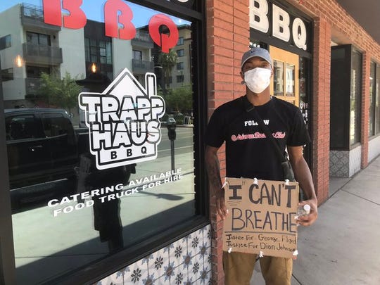 Terrance May eats at Trapp Haus BBQ on June 4, 2020, in downtown Phoenix.