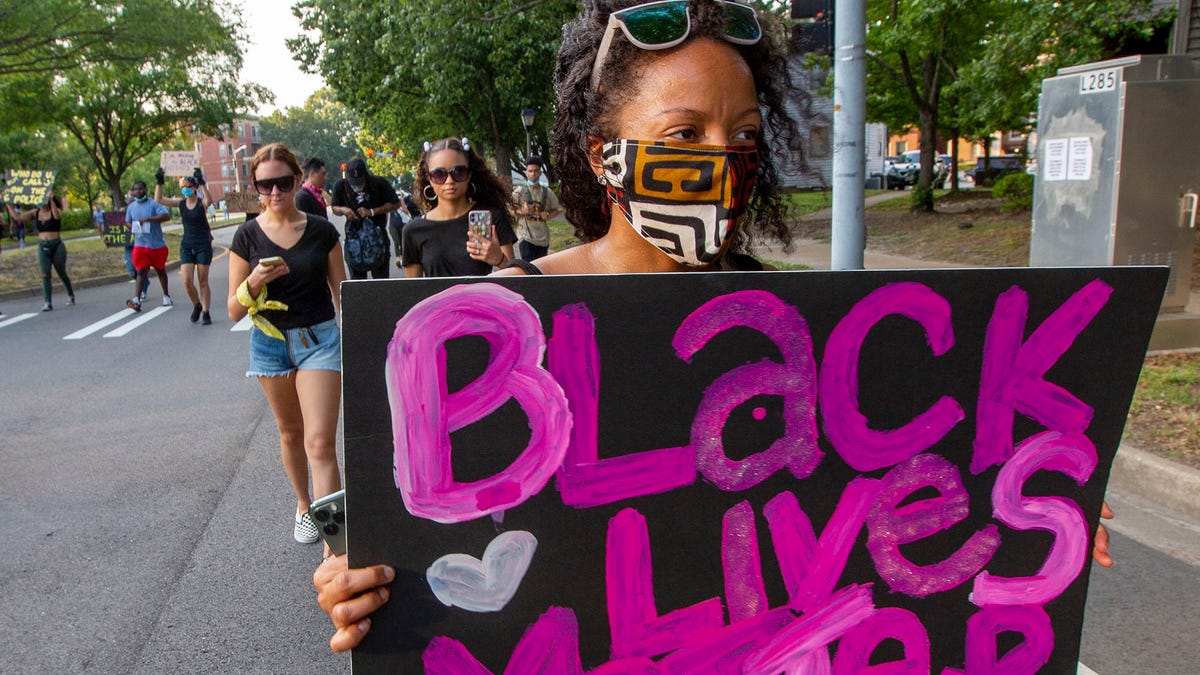 Protesters march on Colley Avenue in Norfolk, Va., Wednesday, June 3, 2020. The group march through Ghent and converge at the Norfolk Confederate Monument in wake of George Floyd's death recently. (The' N. Pham/The Virginian-Pilot via AP) ORG XMIT: VANOV301