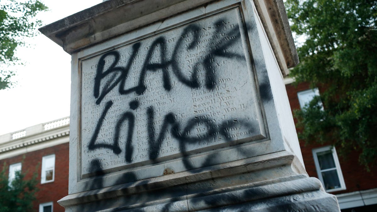 Protest messages are painted on the downtown Athens Confederate War Memorial after the main protest ended in downtown Athens, Ga. on May 31, 2020.  The protest was organized to demonstrate against the death of George Floyd, who died in police custody in Minneapolis on May 25, sparking demonstrations and riots around the country.   