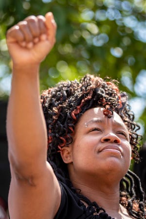 Tamika Palmer, Breonna Taylor's mother, raises a fist as she came to thank and show solidarity with supporters in Jefferson Square Park on what would have been Breonna Taylor's 27th birthday. June 5, 2020