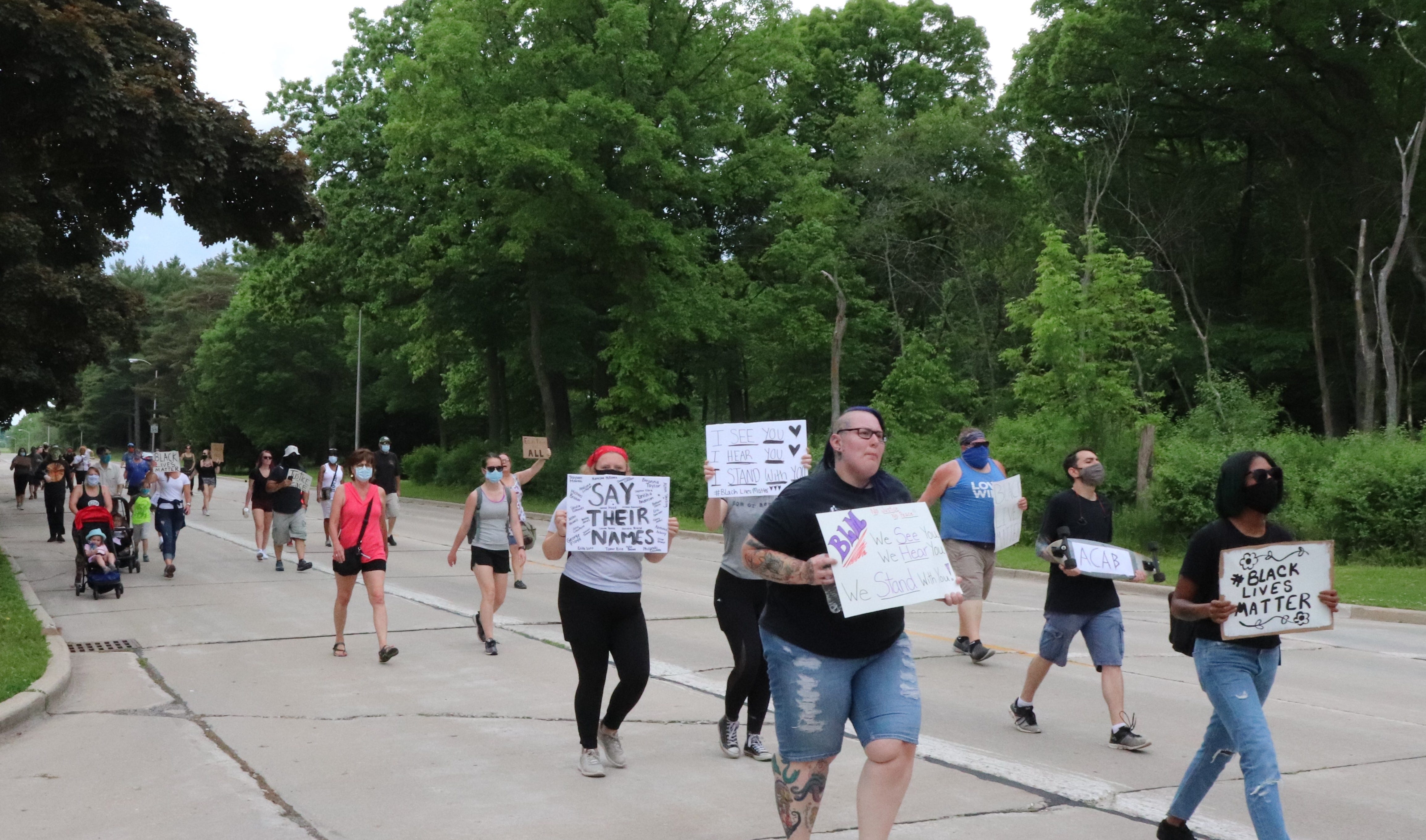 About 50 people march east on Lincoln Avenue in West Allis during a protest on Friday, June 5.