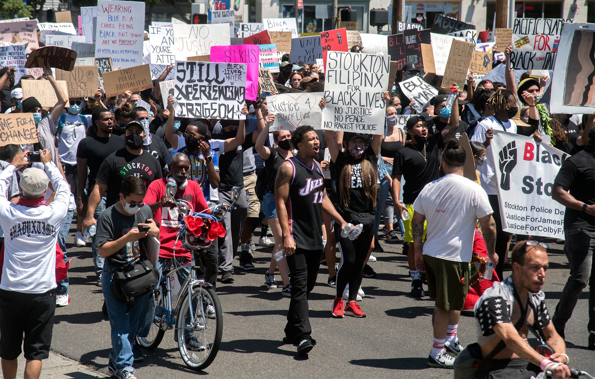 Protesters march down Center Street in downtown Stockton to protest the killing of George Floyd.