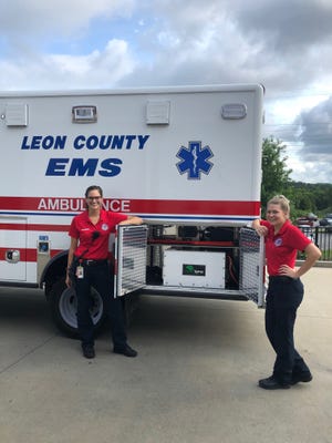 Leon County EMT personnel showing off the auxillary power unit (APU) that powers the ambulance's vital equipment when the engine is turned off.