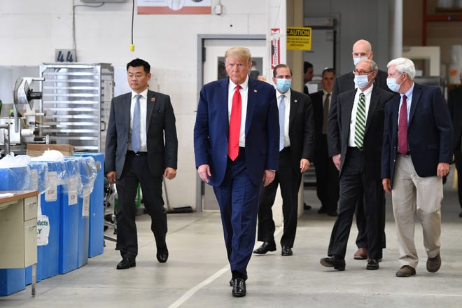 President Donald Trump arrives for a visit to the Puritan Medical Products facility in Guilford, Maine, on Friday