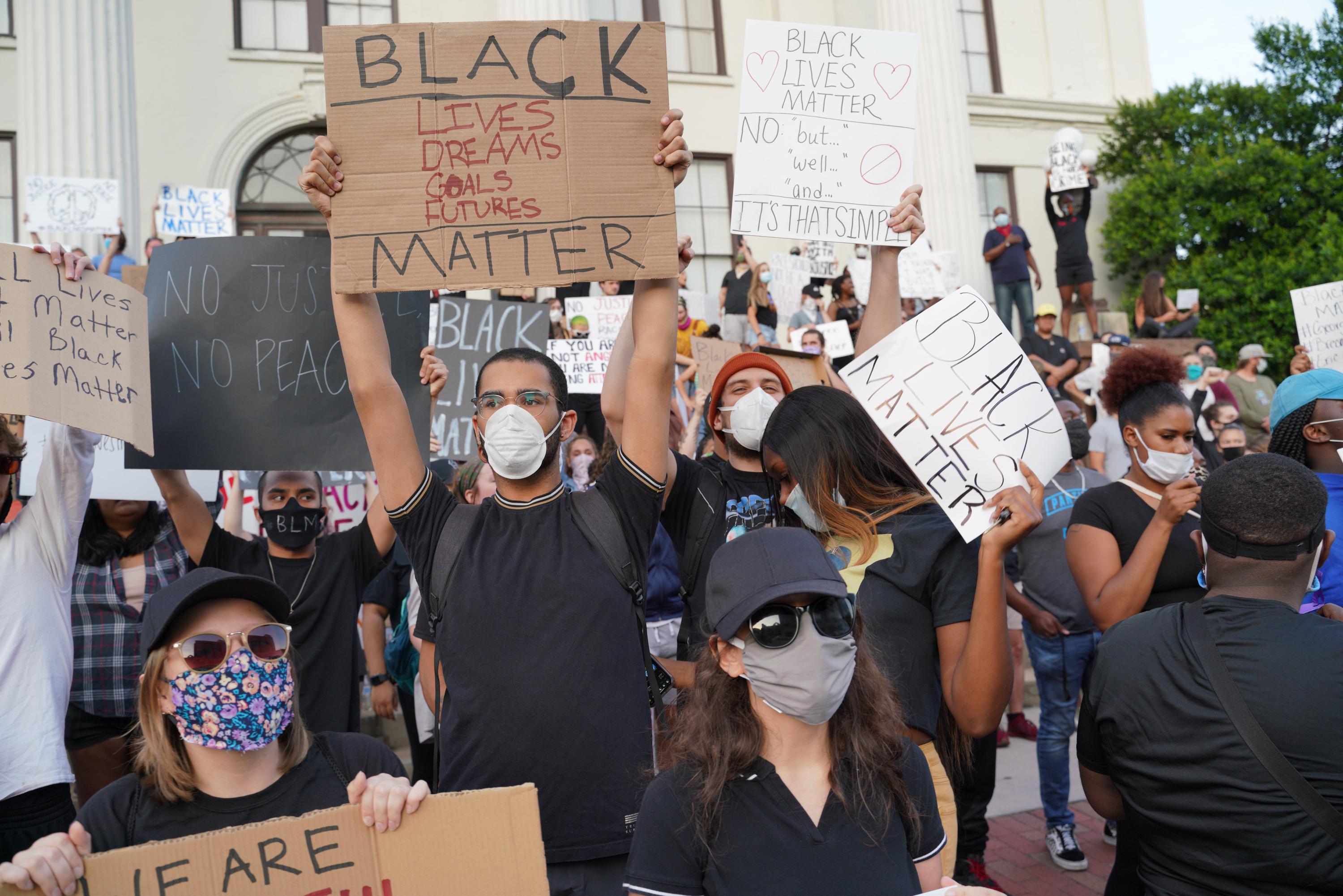 Protesters gathered for a fourth night at City Hall on Tuesday in Wilmington, N.C.