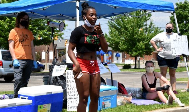 Alexis Sanford, 29, of Lancaster, speaks out against police brutality and racism while sharing personal experiences during a protest in downtown Lancaster June 6.