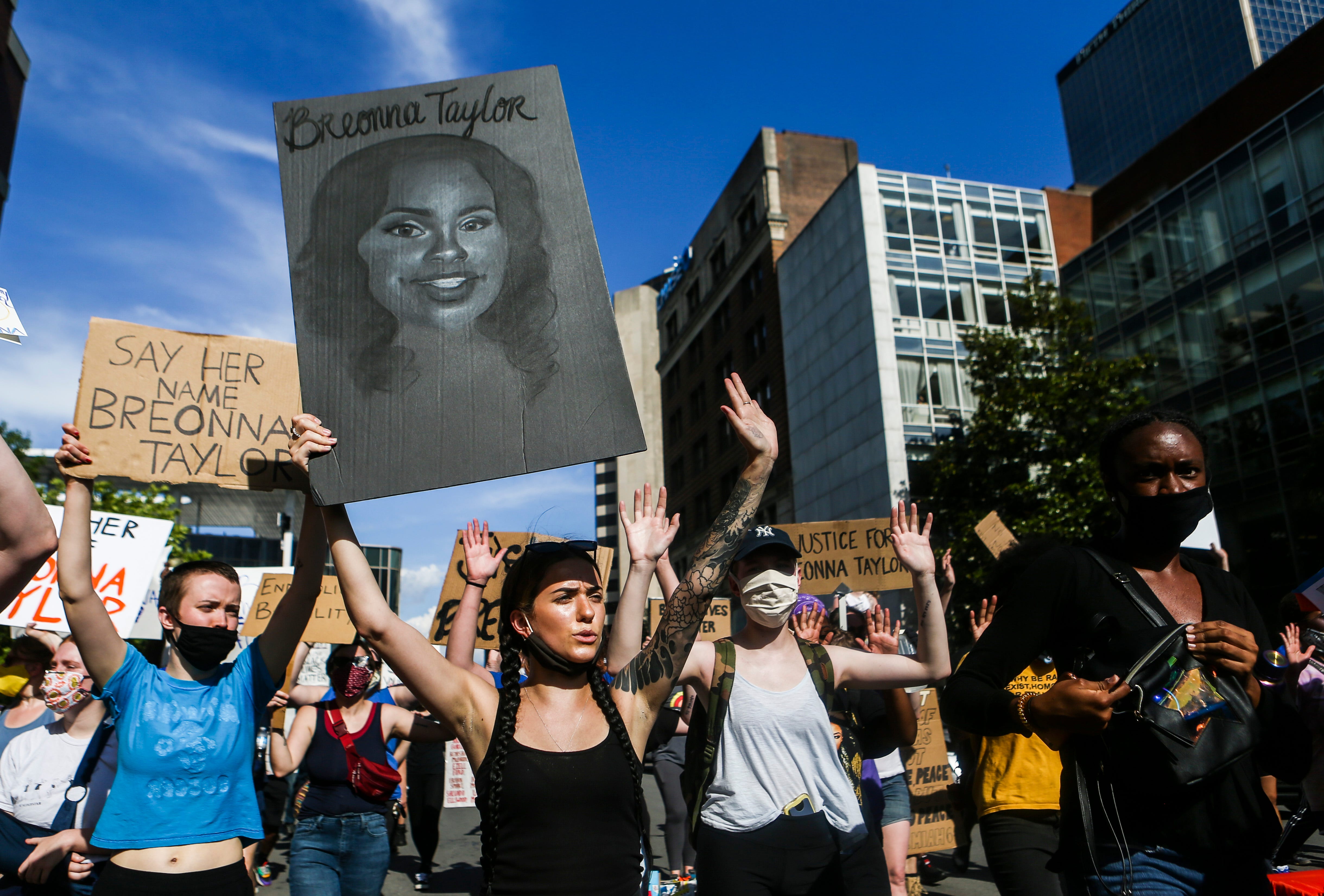 Demonstrators take to the streets of Louisville, Ky., on June 5 to protest the death of EMT Breonna Taylor, who was shot eight times by police during a raid. The officers involved have not been fired.