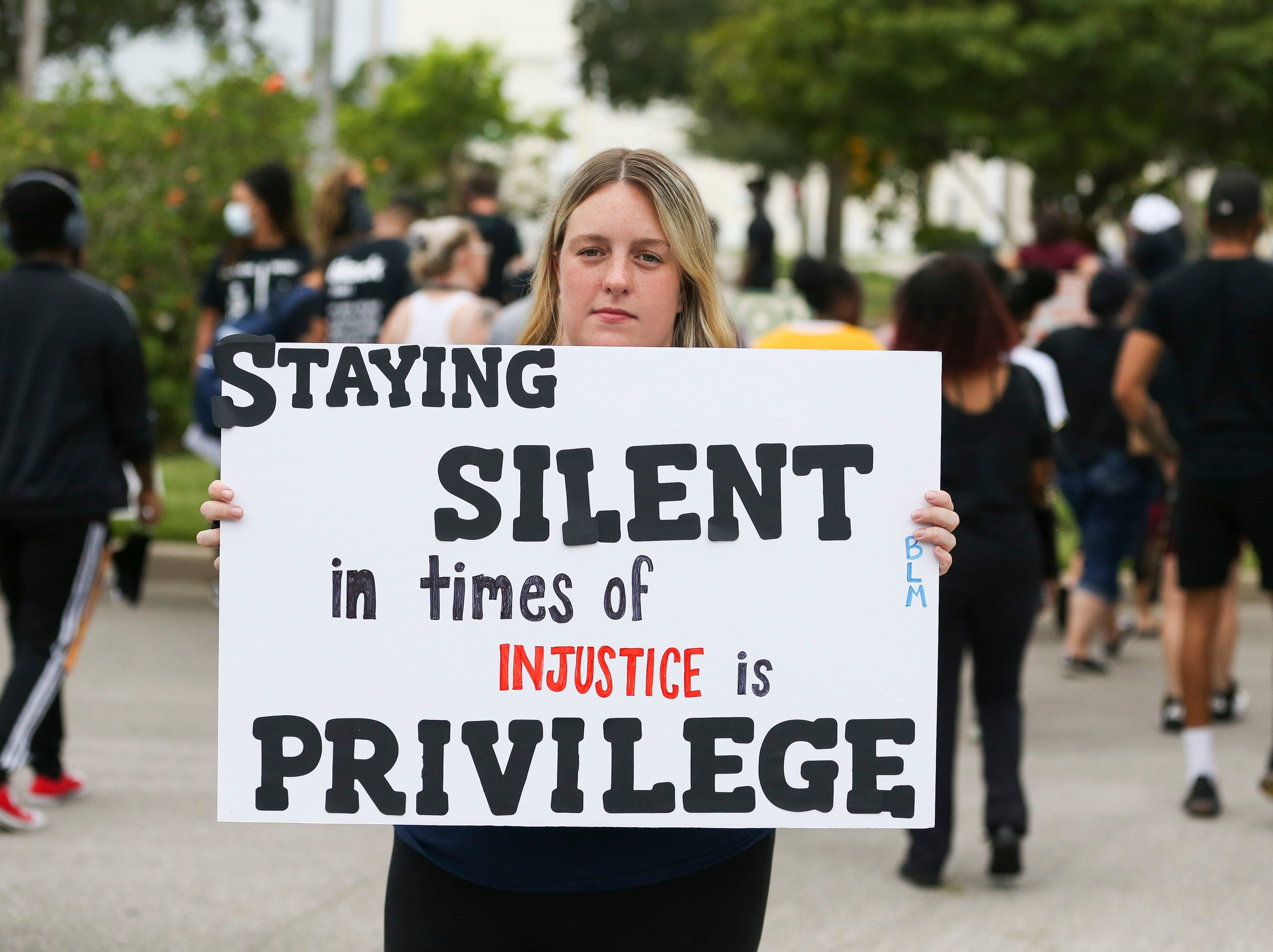 Mara Backer, of Port St. Lucie, attends the peace and justice demonstration at Port St. Lucie City Hall on Saturday June 6, 2020. Port St. Lucie police were in the area for the event in a show of unity. The gathering was a call for justice after the death of George Floyd in Minneapolis police custody on May 25. “I don’t want it to be about me,” said Backer. “I do believe that one person can make a difference and I think this is really important.”