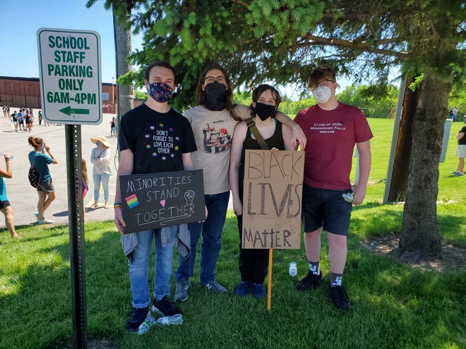 Recent high school graduates attend the peaceful protest rally June 6 at Menomonee Falls North Middle School to support the Black Lives Matter movement.  Pictured are (from left)  Jakob Mork, Kyle Claflin, Regina Nielsen and  Jazzton Dubinsky.
