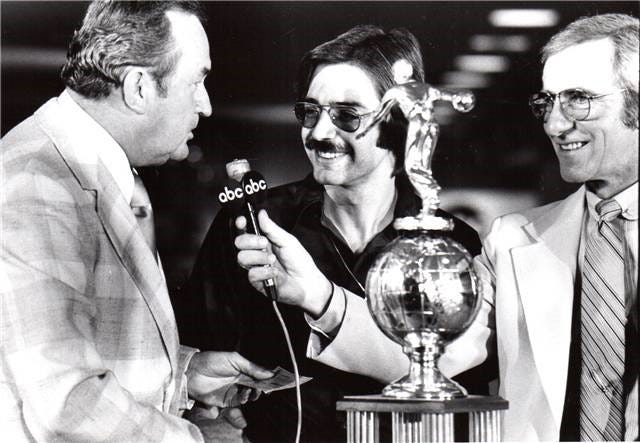 Johnny Petraglia, center, accepts a check for $10,000 after winning the 1977 U.S. Open. At left is C.C. Bearden, the president of the Bowling Proprietors Association of America. At right is ABC announcer Chris Schenkel. The event was televised on ABC-TV.