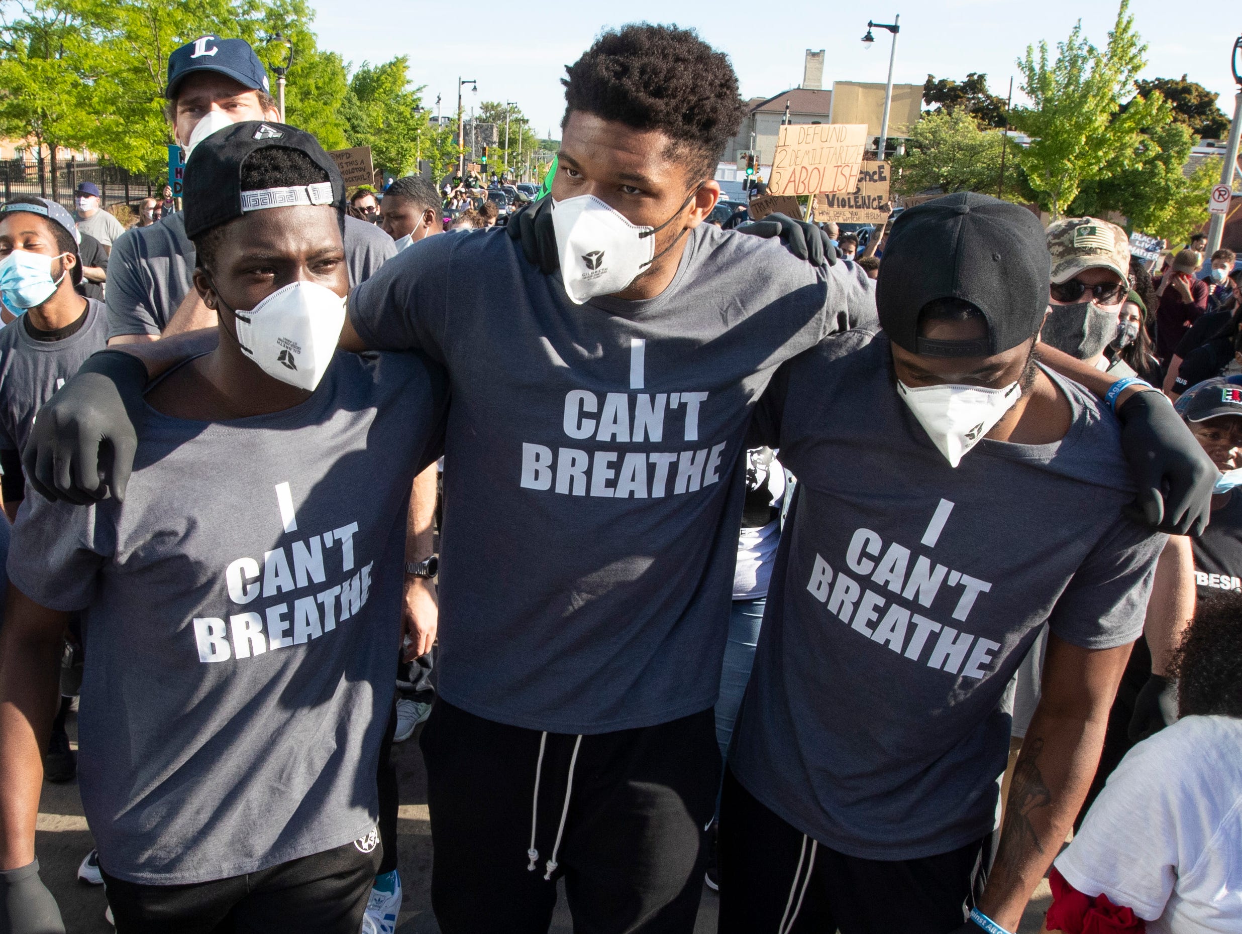 Giannis Antetokounmpo and Bucks teammates march at a protest in Milwaukee.