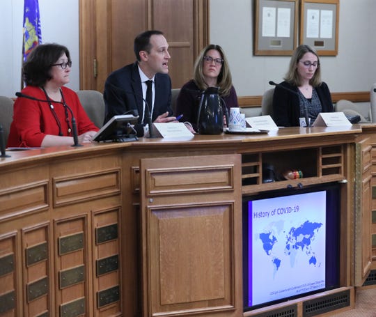 Wisconsin Department of Health Services officials brief lawmakers on the coronavirus outbreak at the state Capitol in this March 4 file photo. State Health Officer Jeanne Ayers, left, was asked to resign in early May amid the pandemic and DHS officials won't say why.