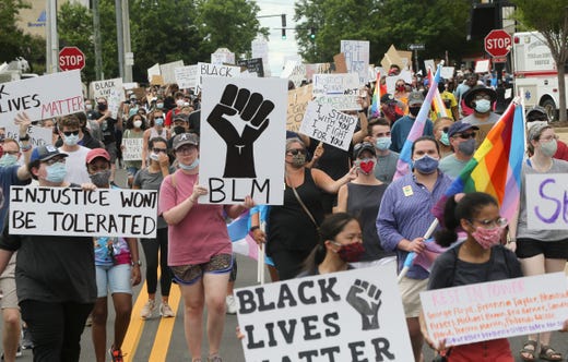 Protesters march on the streets around Government Plaza in Tuscaloosa, Ala. on June 7, 2020 during the T-Town Peaceful Protest.