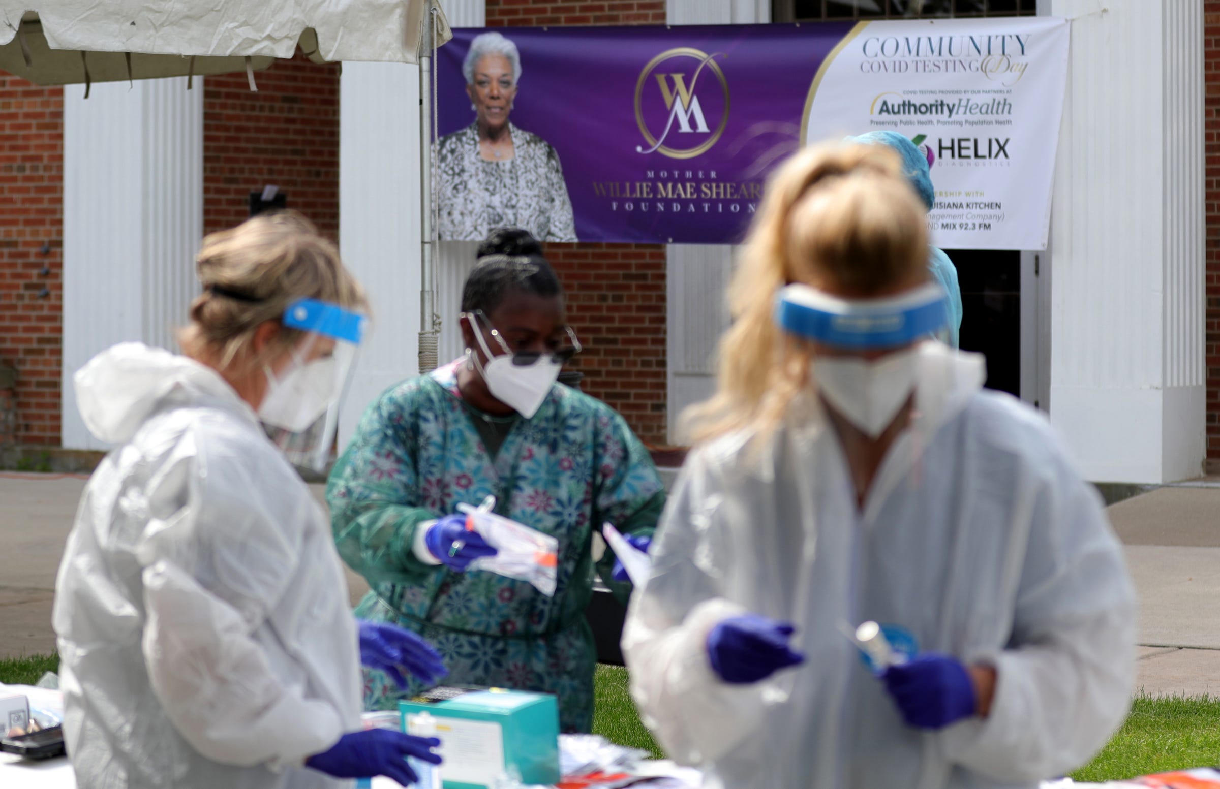 Volunteers do COVID-19 testing during the Greater Mitchell Temple Church of God in Christ community service day that offered free COVID-19 testing in honor of church mother Willie Mae Sheard who passed from complications of the coronavirus April 19. Locals were tested free of charge Wednesday, June 3, 2020 in Detroit.