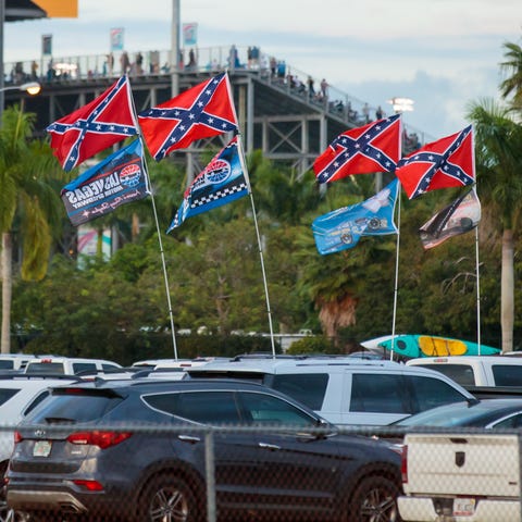 Confederate flags fly in the parking lot at Homest