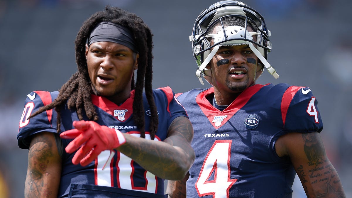 Texans quarterback Deshaun Watson (4) speaks with wide receiver DeAndre Hopkins (10) prior to the game against the Los Angeles Chargers at Dignity Health Sports Park.