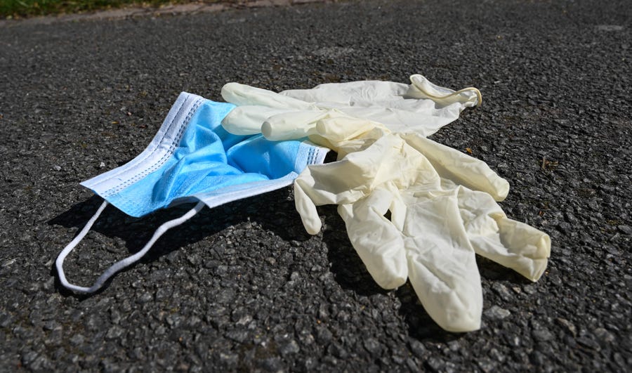 This is gross, people: Latex gloves and a mask are discarded on the pavement in Lille, northern France. Since the start of the COVID-19 pandemic, city cleaning services in the French town have been increasingly picking up masks and gloves that people have thrown on the ground after use.