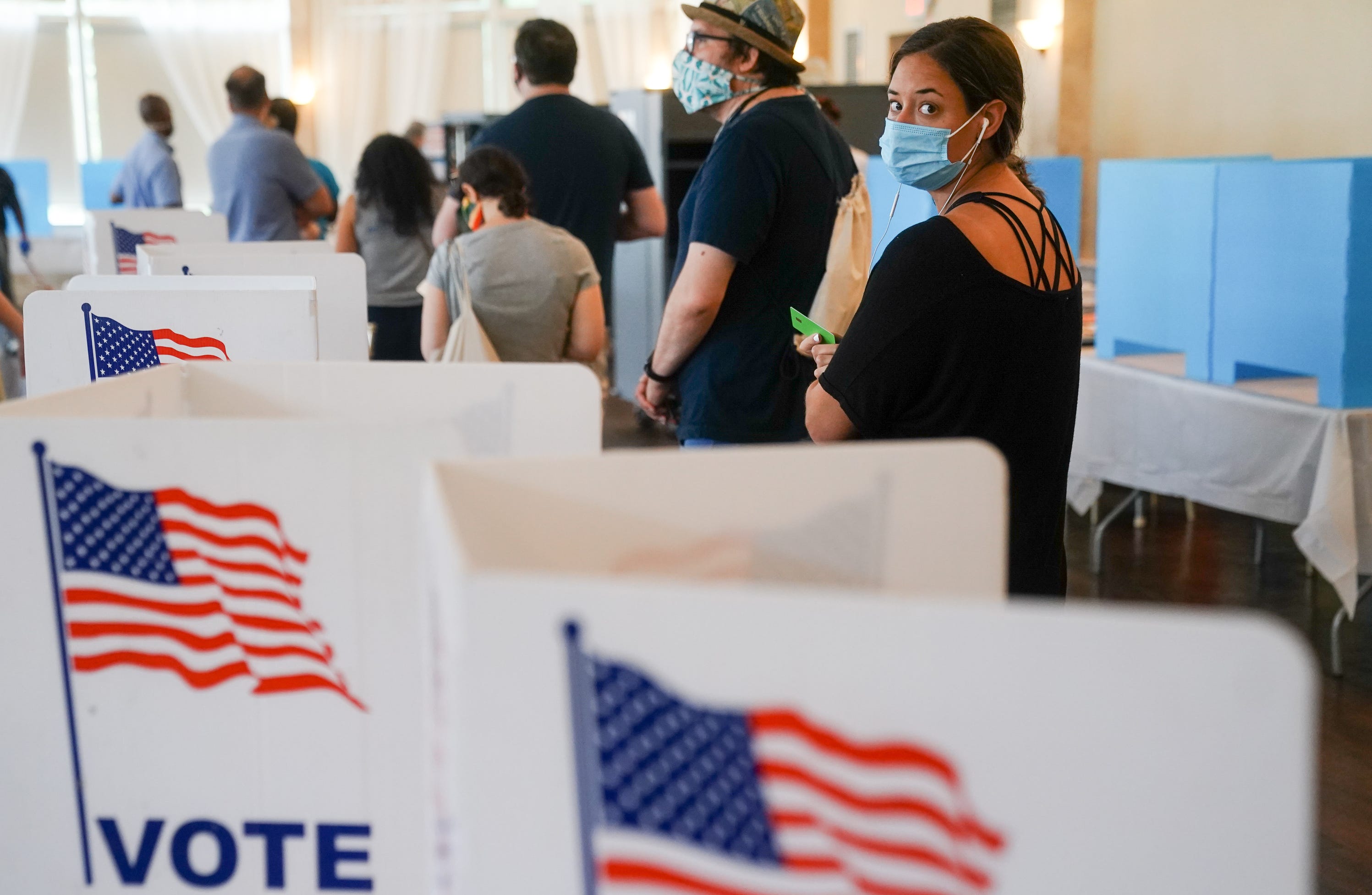 People wait in line to vote in Georgias Primary Election on June 9, 2020 in Atlanta. Voters in Georgia, West Virginia, South Carolina, North Dakota, and Nevada are holding primaries amid the coronavirus pandemic.