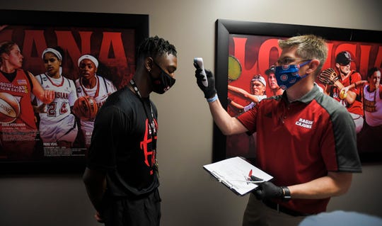 Cajuns football players check in for voluntary workouts at the UL Athletics Complex on Tuesday, June 9, 2020, in Lafayette.