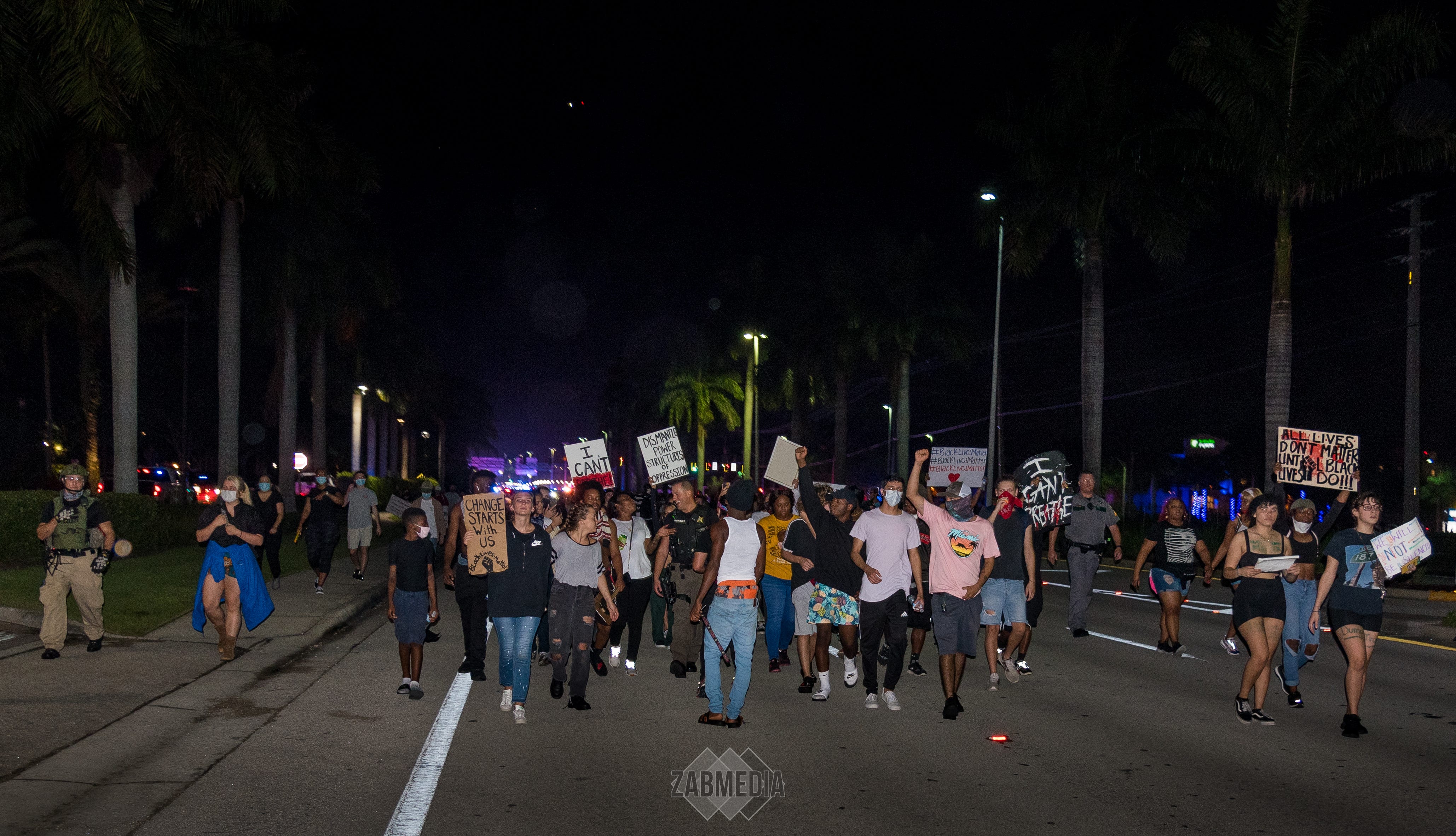 Collier sheriff's Cpl. Dan McCoy asked Lisa Martinez and Cherry Estelomme to walk alongside him at a June 1 protest in Naples, Florida. “If you guys make sure I don’t get jumped, I’ll walk with you.” 
“You’re not going to get jumped,” Cherry said. “We got you.”