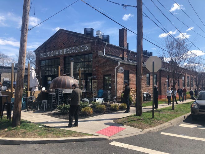 People line up for pickup outside Montclair Bread Company during the pandemic shutdown.