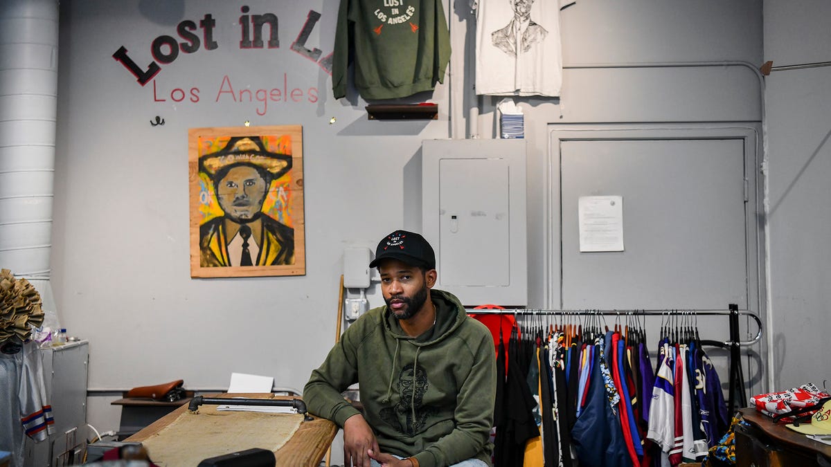 Joel Stallworth poses for a portrait in his store, The Small Shop LA, in Downtown Los Angeles, Calif. Stallworth's store was one of the dozens of stores across Los Angeles that were looted over the past week.