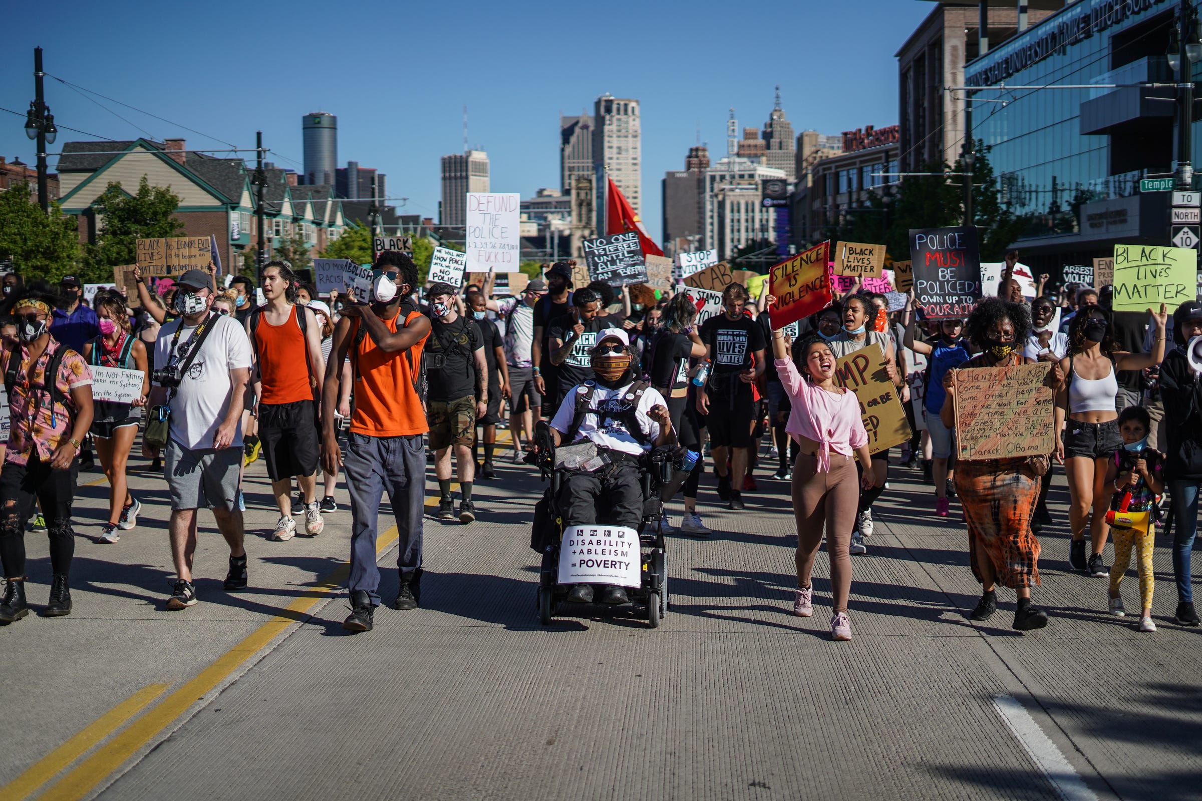 Protesters march along Woodward Avenue in downtown Detroit during the eleventh day of protests against police brutality on Monday, June 8, 2020.