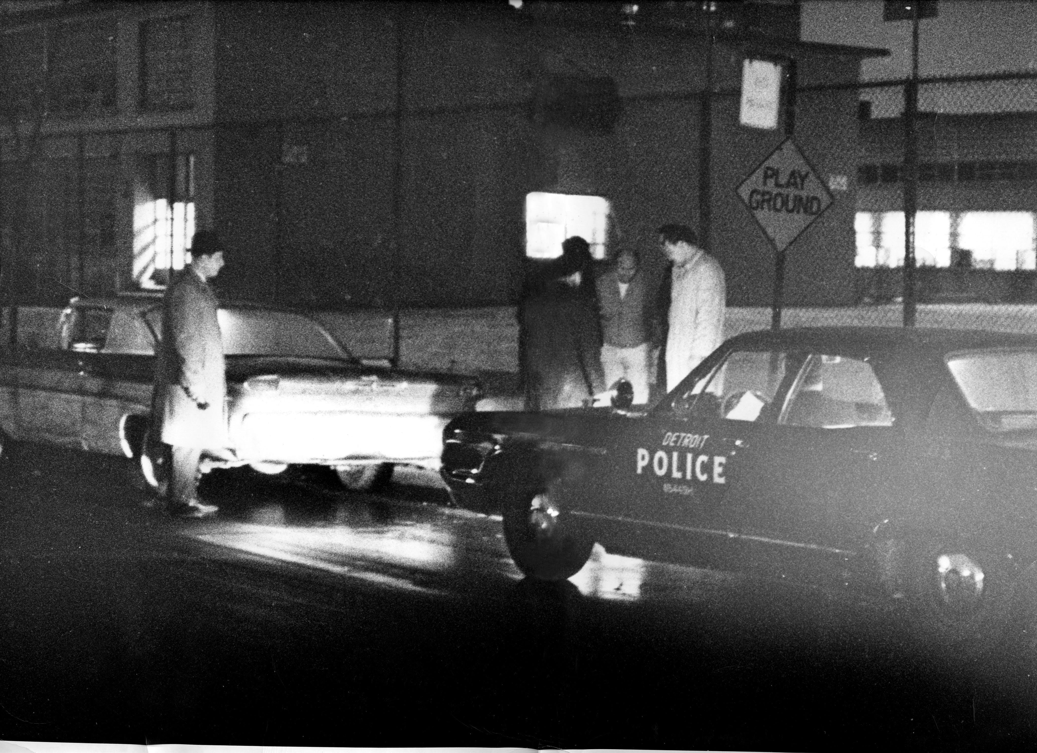 Members of one of the Detroit police units known as "Big Four" units make a stop. A Big Four unit, consisting of three plain clothes cops and a uniformed driver in a heavily armed sedan, became notorious for their provocations in black neighborhoods.