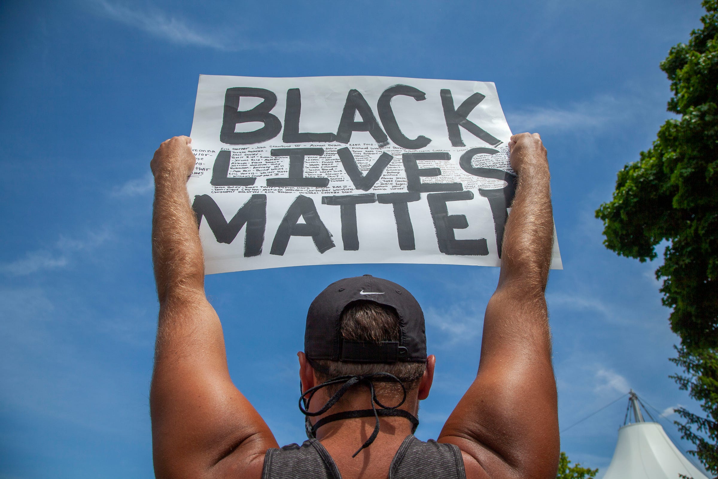 Protesters gather and listen to speakers before they march on the MacArthur Bridge across the Detroit River to Belle Isle during a rally in Detroit, Friday, June 5, 2020, protesting police brutality and the death of George Floyd.