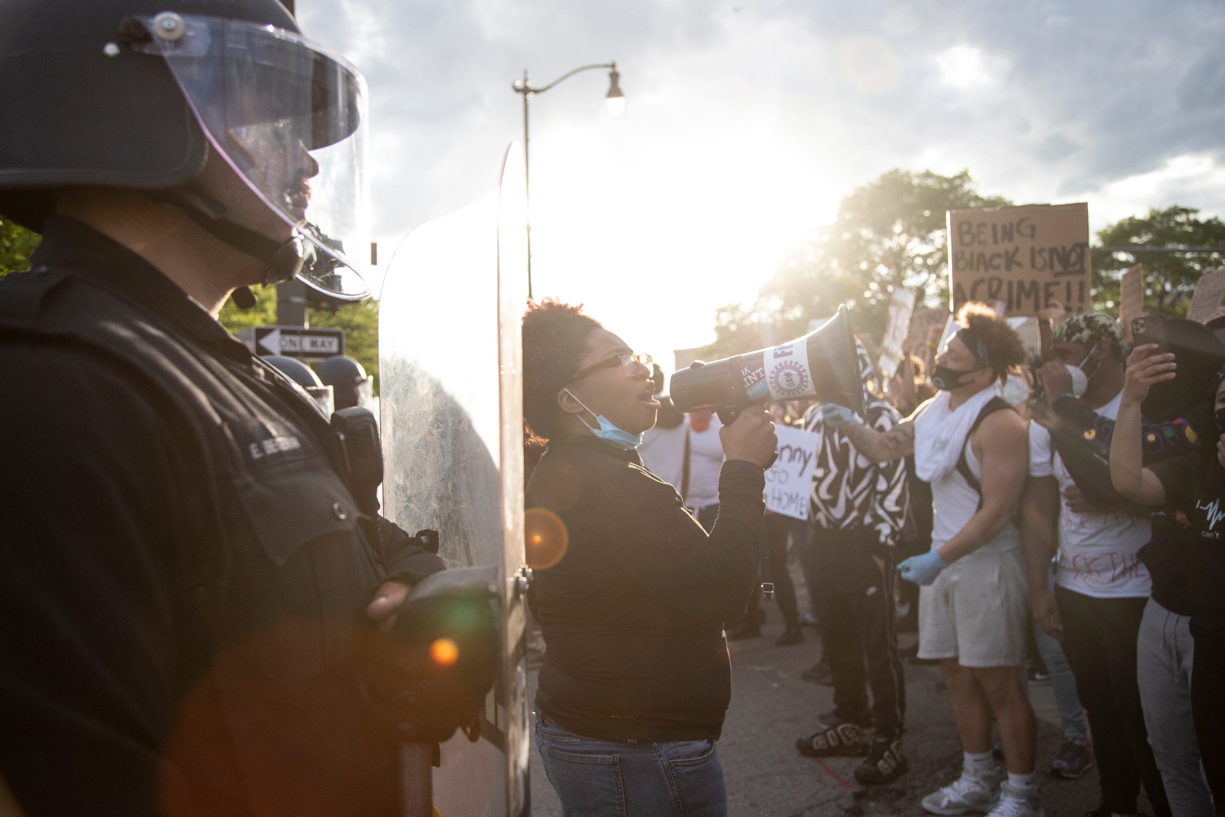 Nakia-Renne Wallace of Detroit chants "No justice, no peace" at the corner of Third and Michigan Avenue in Detroit on Saturday, May 30, 2020.