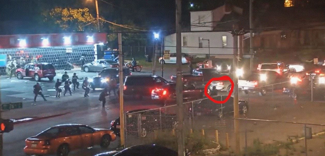 LMPD Officer Katie Crews, while shooting pepper balls at YaYa's BBQ, appears to change weapons, as shown in street surveillance video the night David McAtee was killed by the National Guard in his doorway.