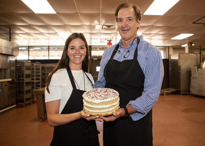 Miller Cowan (left), Ed Crenshaw, who has been baking for more than 20 years, launched an e-commerce branch of his bakery called Sugar Avenue.Ed Crenshaw and his daughter Miller Cowan pose with a cake at Sugar Avenue Bakery in Memphis, Tenn., on Wednesday, June 10, 2020.