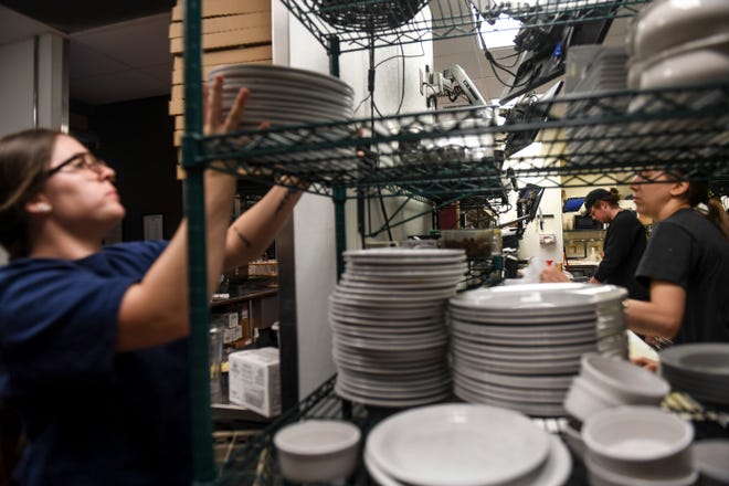 MacKenzie River employees prepare food in the kitchen on Thursday, June 11, 2020 at MacKenzie River in Sioux Falls. The restaurant is currently hiring for positions in their kitchen and host stand. 