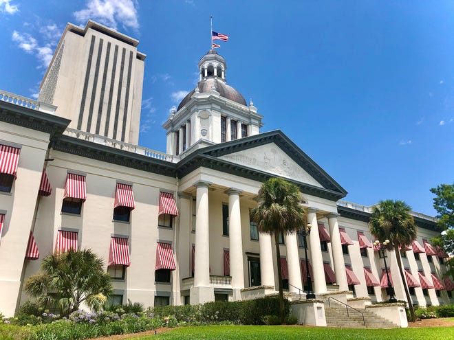 Flags at half staff above the old Capitol, Tallahassee, Fla.